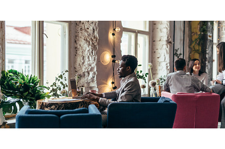 African-american man using laptop, a Business Photo by undrey