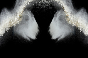 Clouds of white flour or powder scattering against a black backg, a Background Photo by ndanko