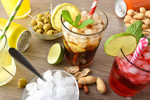 Detail of refreshing drinks and snacks on wooden table, a Food & Drink Photo by Davizro's Market