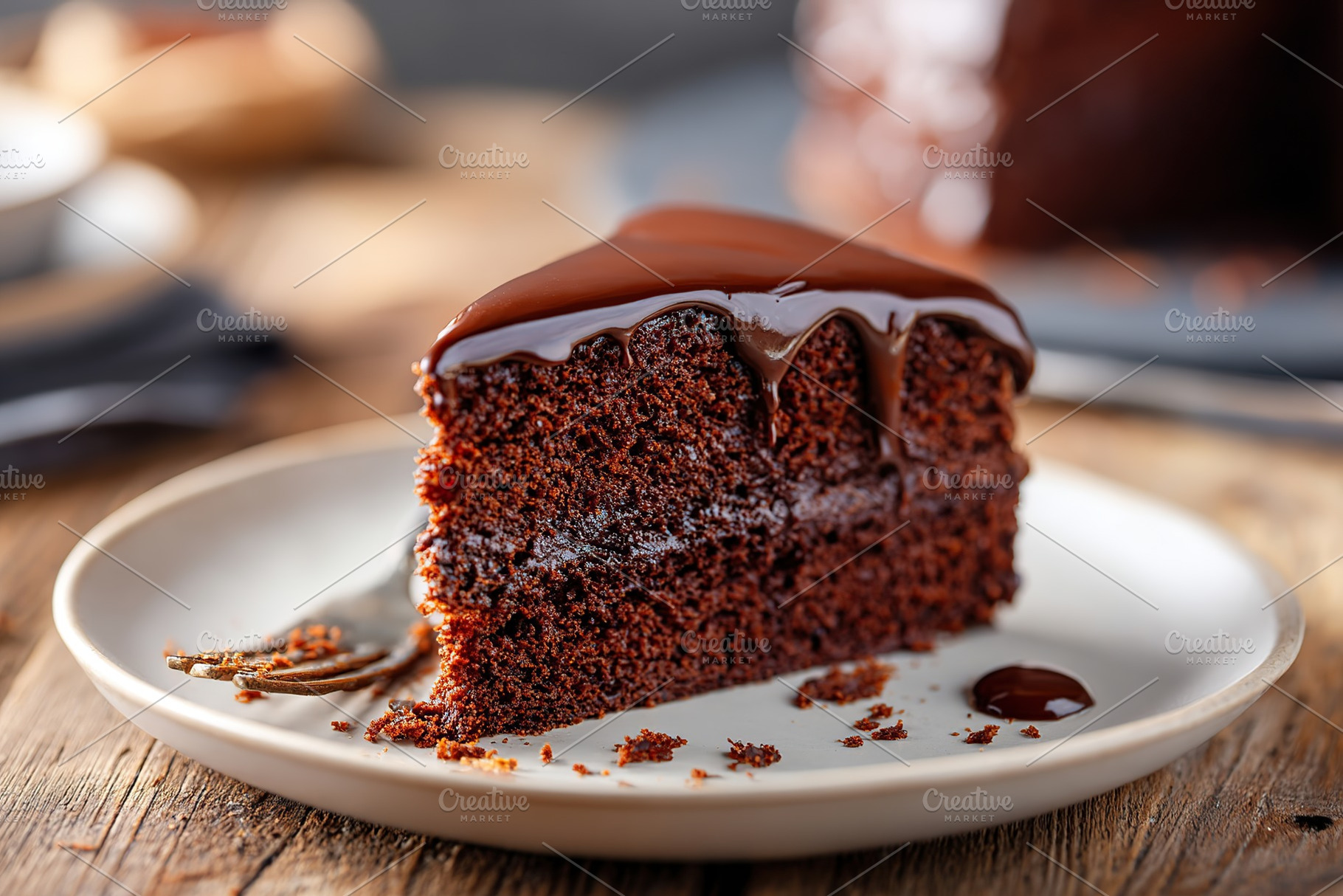 Rich chocolate sponge cake slice served on a white plate with a drizzle of choc, a Food & Drink Photo by AlyaAnd