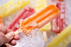Colorful fruit ice pops on crushed ice, summer refreshment concept, a Food & Drink Photo by etorres69