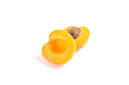 Fresh sweet apricots isolated on white background, a Food & Drink Photo by AtlasStudio