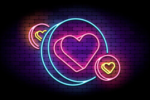 Neon sign with hearts in circles.