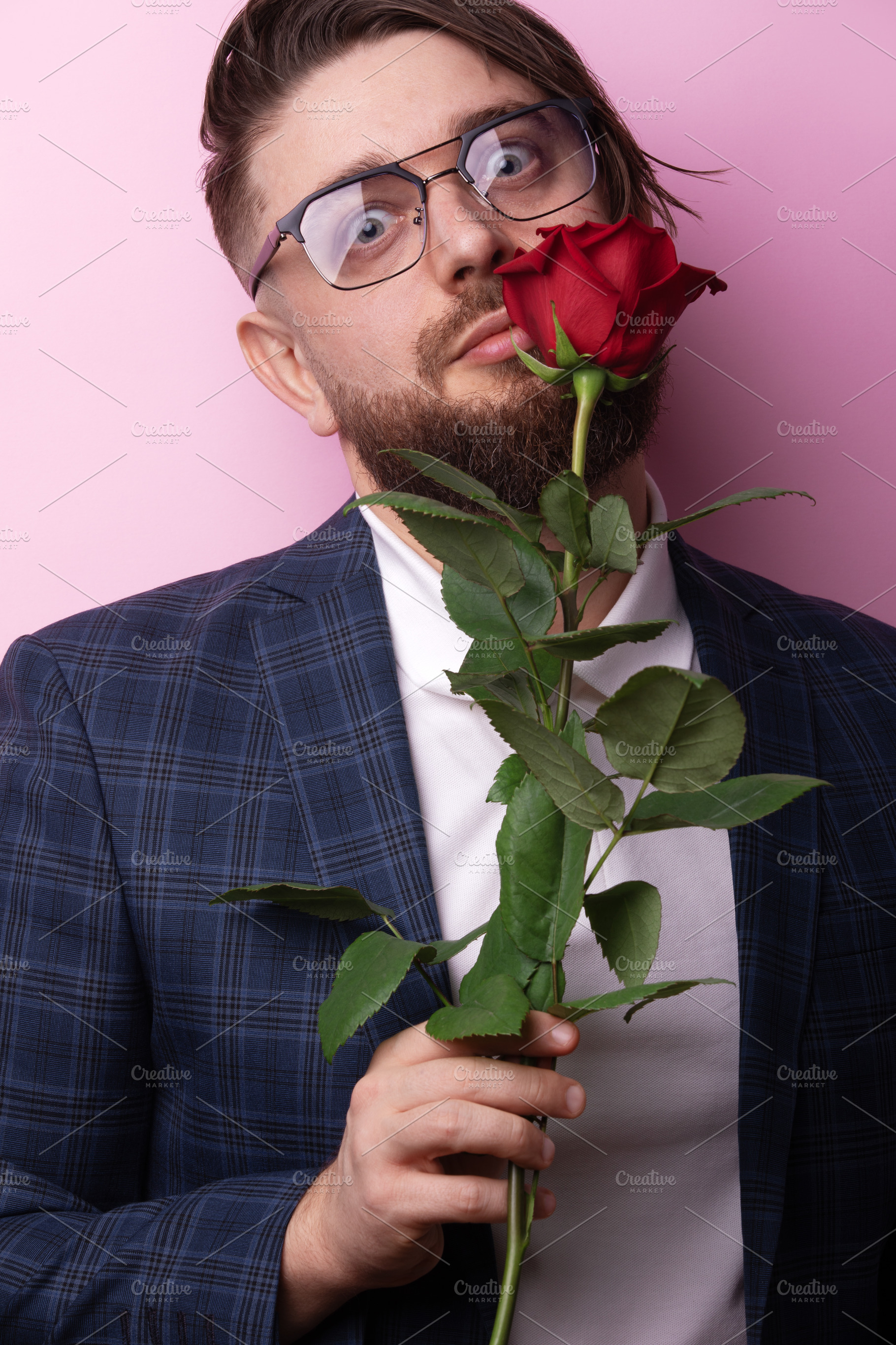 Man Holding Red Rose, a Person Photo by Ales Munt