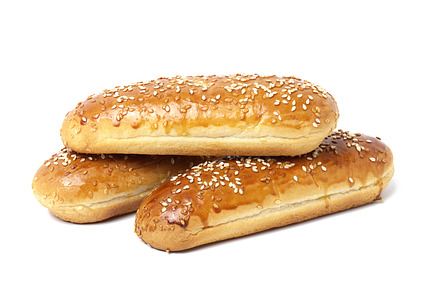 baked oblong sesame hot dog bun isolated on white background, st, a Food & Drink Photo by ndanko