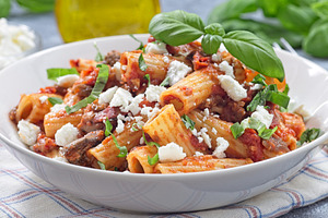 Rigatoni alla Norma pasta with eggplant and tomato, basil and ricotta salata, h, a Food & Drink Photo by iuliia_n