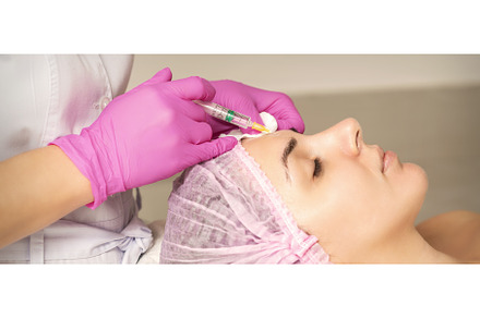 Woman receiving injection of botox, a Health & Medical Photo by okskukuruza