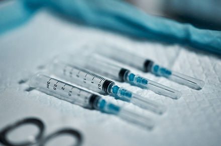 Needle syringe, healthcare tools and surgery, medicine and medical tray with drugs, procedure and anesthesia closeup. Vaccine, health equipment and hospital with injection, science and medication, a Photo by Peopleimages.com