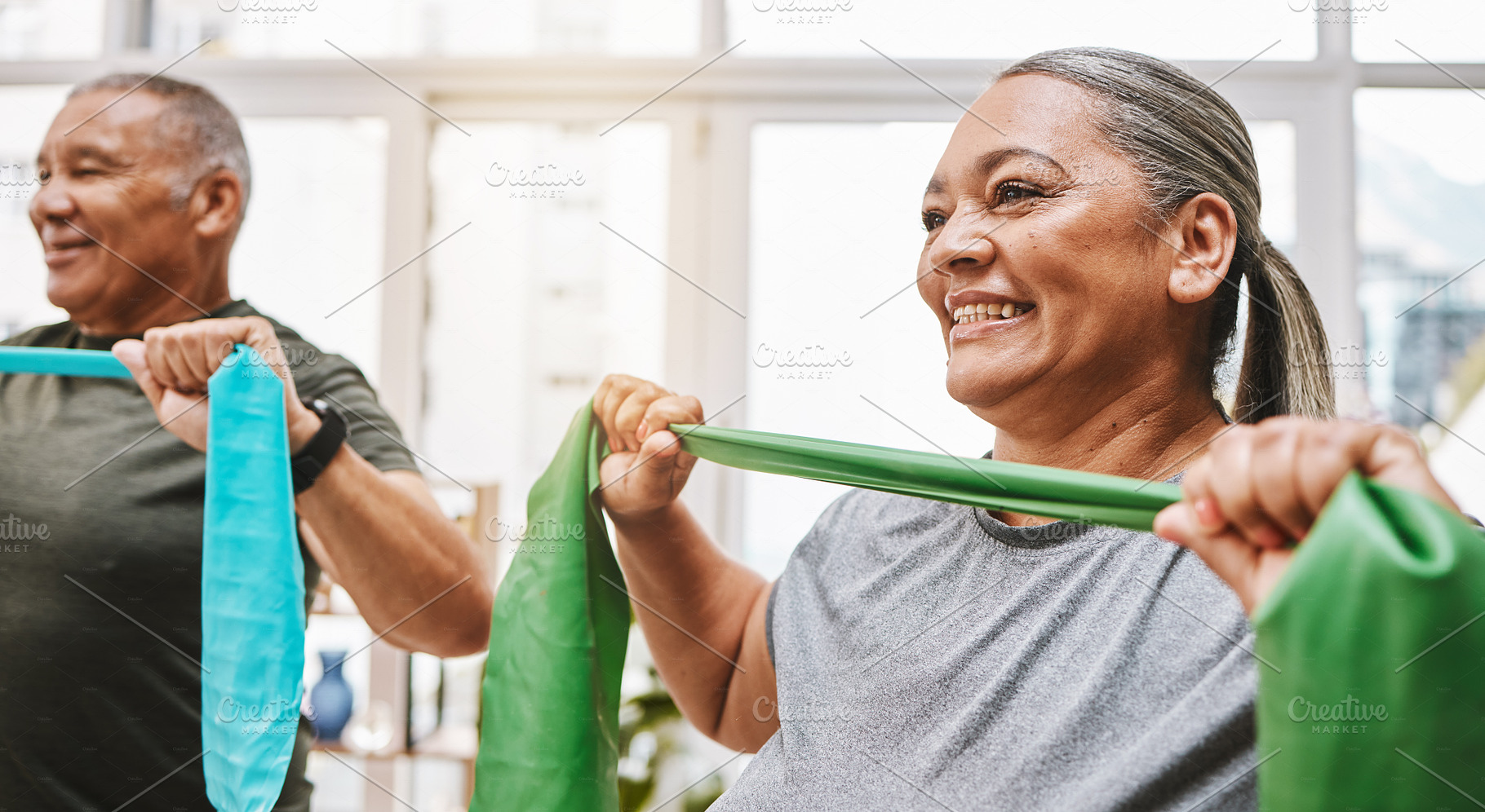 Physiotherapy, stretching band and senior couple with teamwork for muscle wellness, rehabilitation and support together. Elderly black people or friends smile in physical therapy with strong progress, a Photo by Peopleimages.com