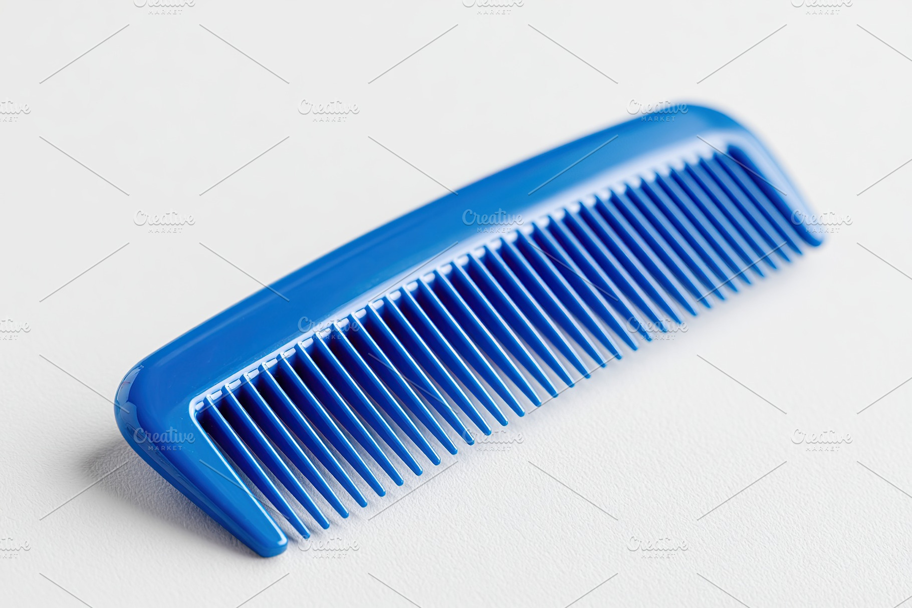 Straight blue plastic comb with even teeth placed on a light background for sty, a Beauty & Fashion Photo by AlyaAnd