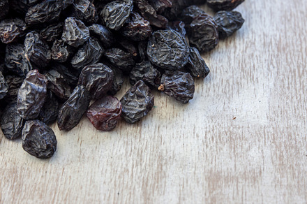 Background from dark blue raisins c stock photo containing delicious and, a Food & Drink Photo by TanaCh