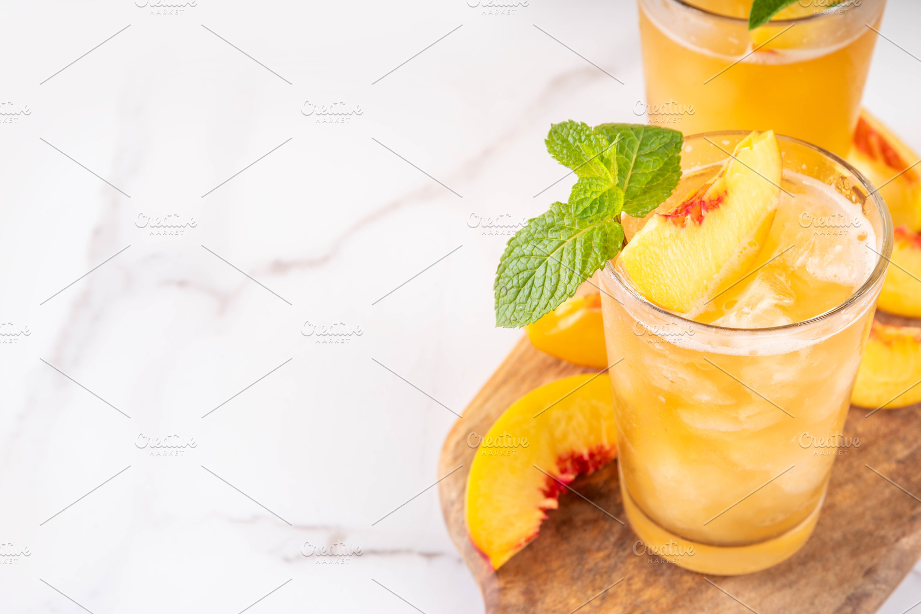 Summer cold drink, peach iced tea slushie cocktail, a Food & Drink Photo by Rimma