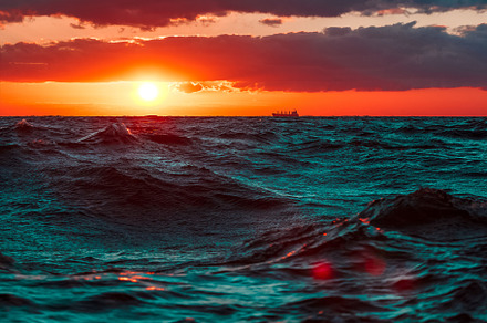 Romantic sunset over the sea containing beautiful, blue, and bright, a Nature Photo by InfinitumProdux