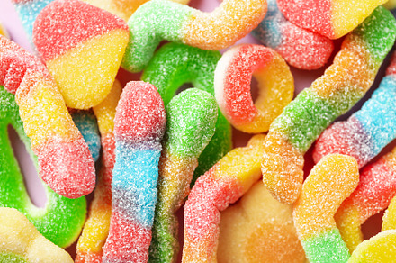 Gummy candies all over background, close up, a Food & Drink Photo by AtlasStudio PRO