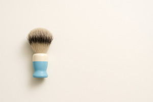 Men health awareness shaving brush on light background, a Photo by Dvoevnore photos