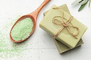 Natural olive soap bars with green bath salt and olive leaves on, a Health & Medical Photo by Olena Rudo