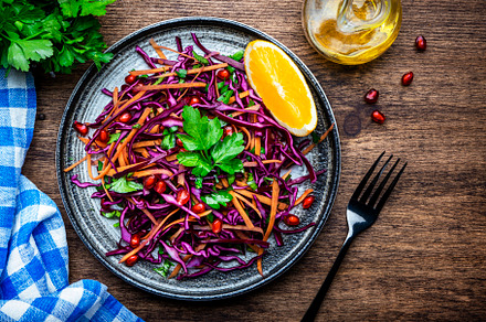 Coleslaw red cabbage salad with carrot, parsley, pomegranate and, a Food & Drink Photo by 5PH