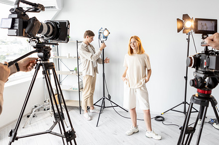 Behind scene female posing team work equipment, a Photo by Photo Drive Studio