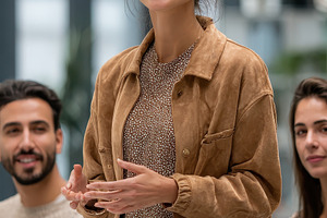Young woman giving presentation smil, a Photo by Pixeness Studio