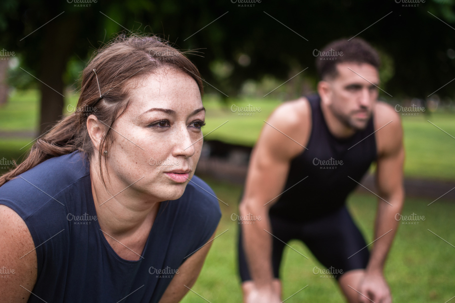 Tired man and woman resting after outdoor fitness workout in park, a Photo by etorres69