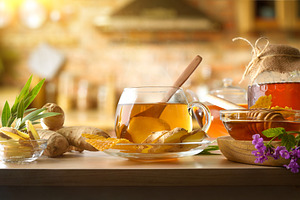 Freshly prepared ginger and honey infusion on rustic kitchen, a Food & Drink Photo by Davizro's Market