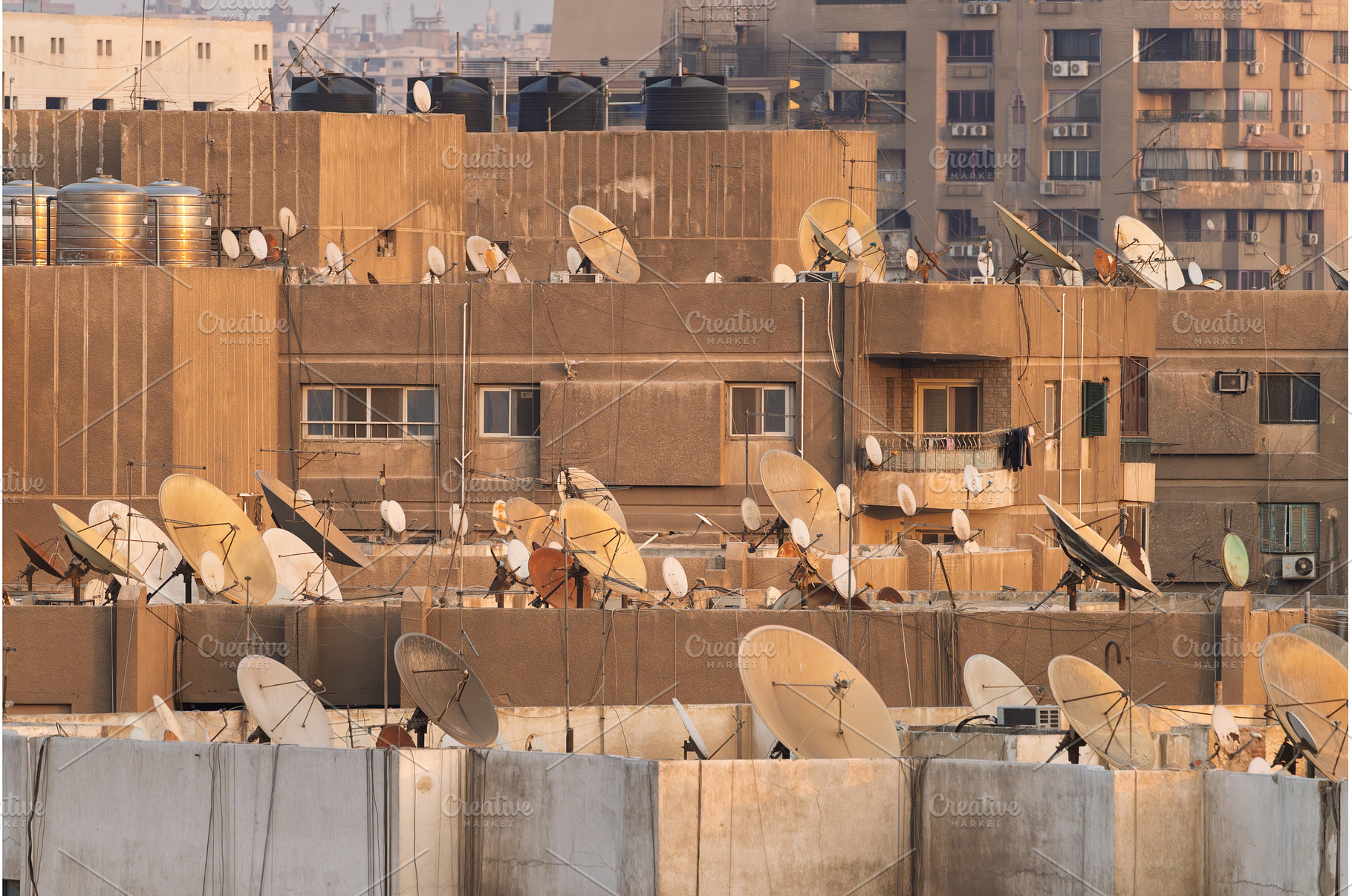 Many satellite dishes crowd the, an Architecture Photo by Backyard Stock