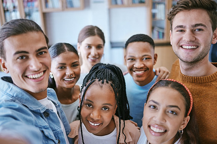 Portrait, friends and university selfie by students in library, learning and relax together. Education, diversity and friendship with college group looking happy and cheerful while bonding at school, a Photo by Peopleimages.com