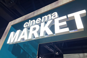 Illuminated entrance sign for a cinema themed market in modern interior design, a Photo by AS photostudio