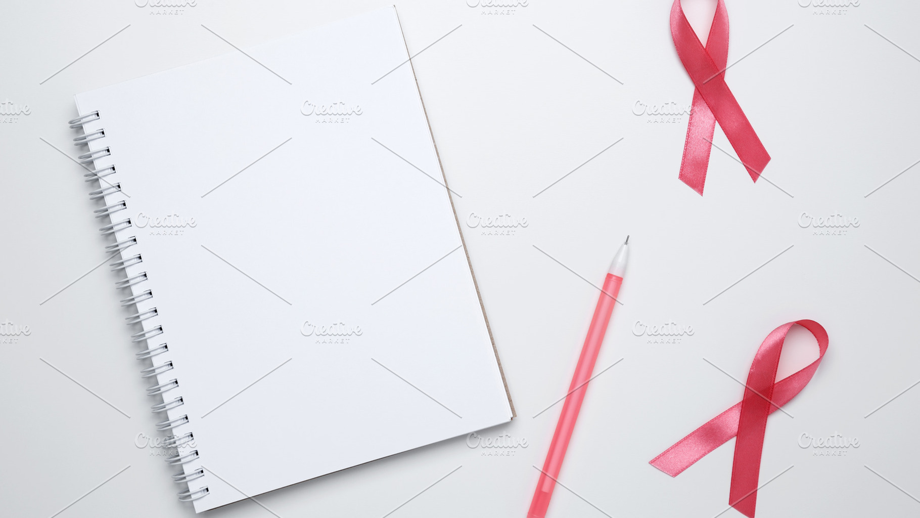 Woman arranging preventive checkup with pink ribbon visible, symbolizing breast, a Photo by matucha