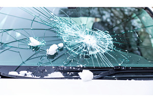 A cracked car windshield covered, a Transportation Photo by Igor Tichonow