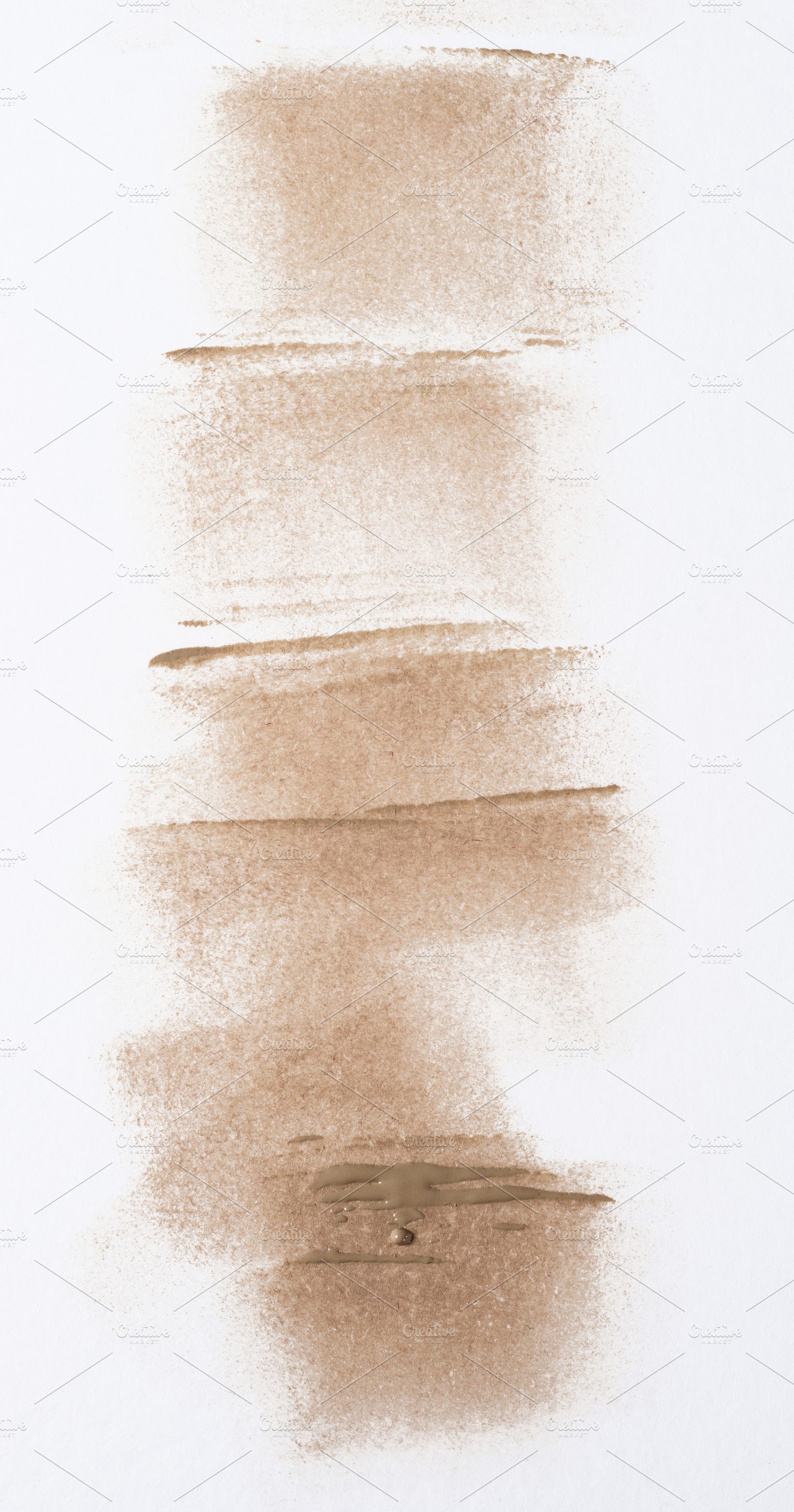 Chaotic strokes of foundation on isolated background, cosmetics, an Abstract Photo by ndanko