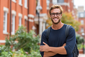 Smiling male student with glasses, a School & Education Photo by MistyDay
