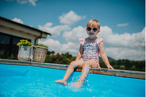 Little girl enjoying summer by the