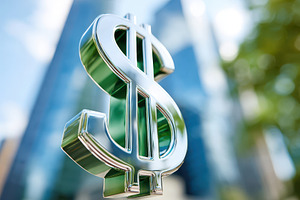 Shiny dollar sign with blurred city background, a Business Photo by AlyaAnd