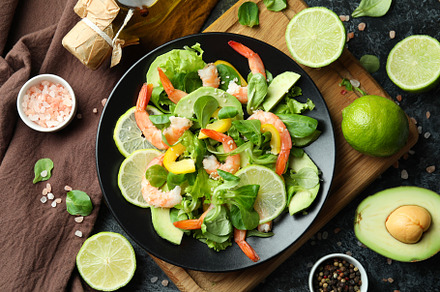 Concept of tasty eating with shrimp salad on black smokey backgr, a Food & Drink Photo by AtlasStudio PRO