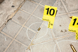 Crime scene with bullet casing and evidence markers