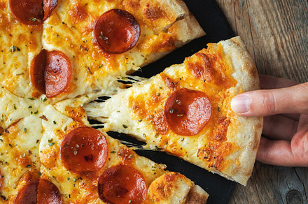 A slice of hot Italian pizza with stretching cheese. Pizza pepperoni on a dark, a Food & Drink Photo by Budarinphoto