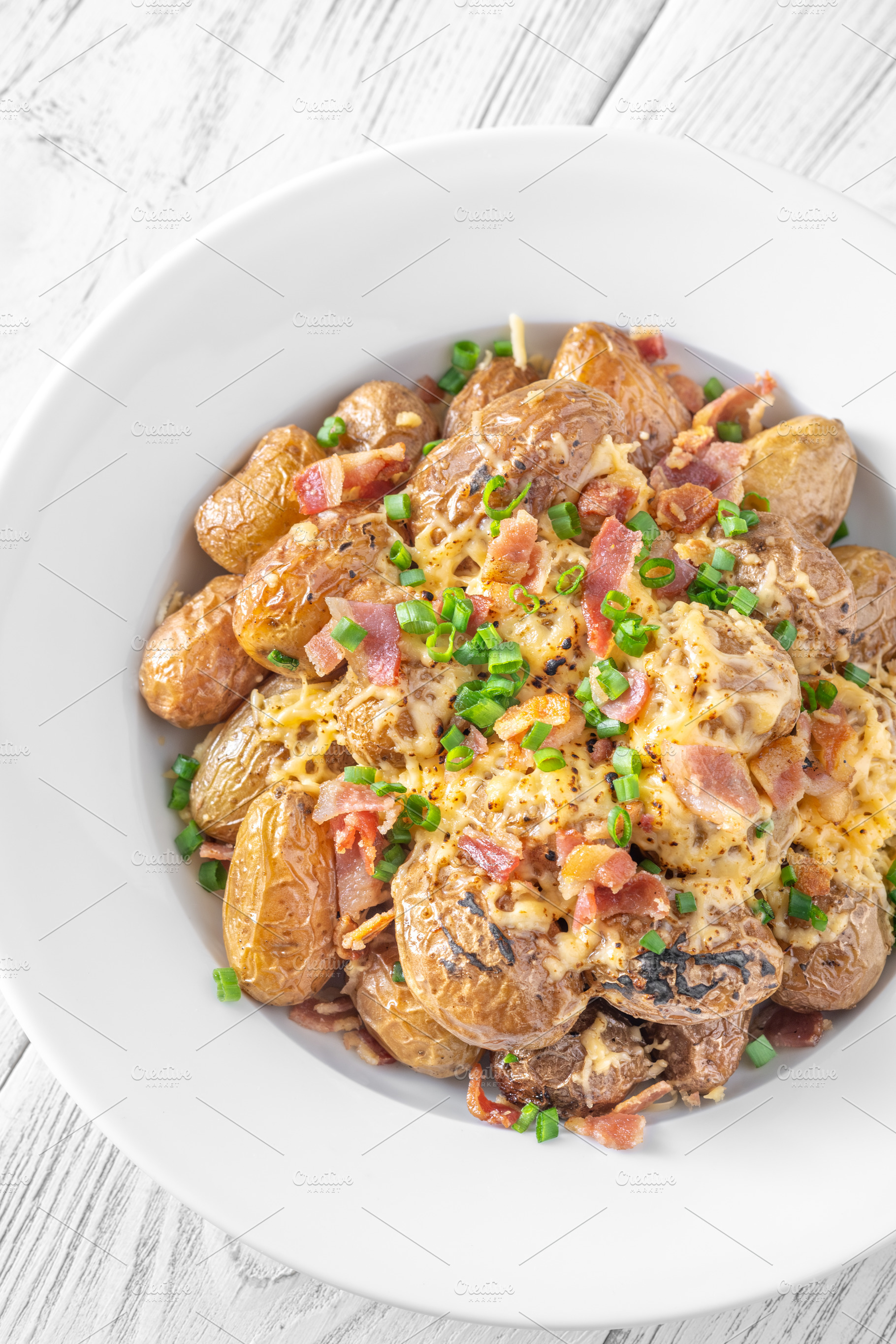 Baked baby potatoes with bacon, a Food & Drink Photo by Alexander Prokopenko