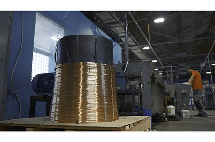 Worker starts machine with copper, an Industrial Photo by Media Whale Stock