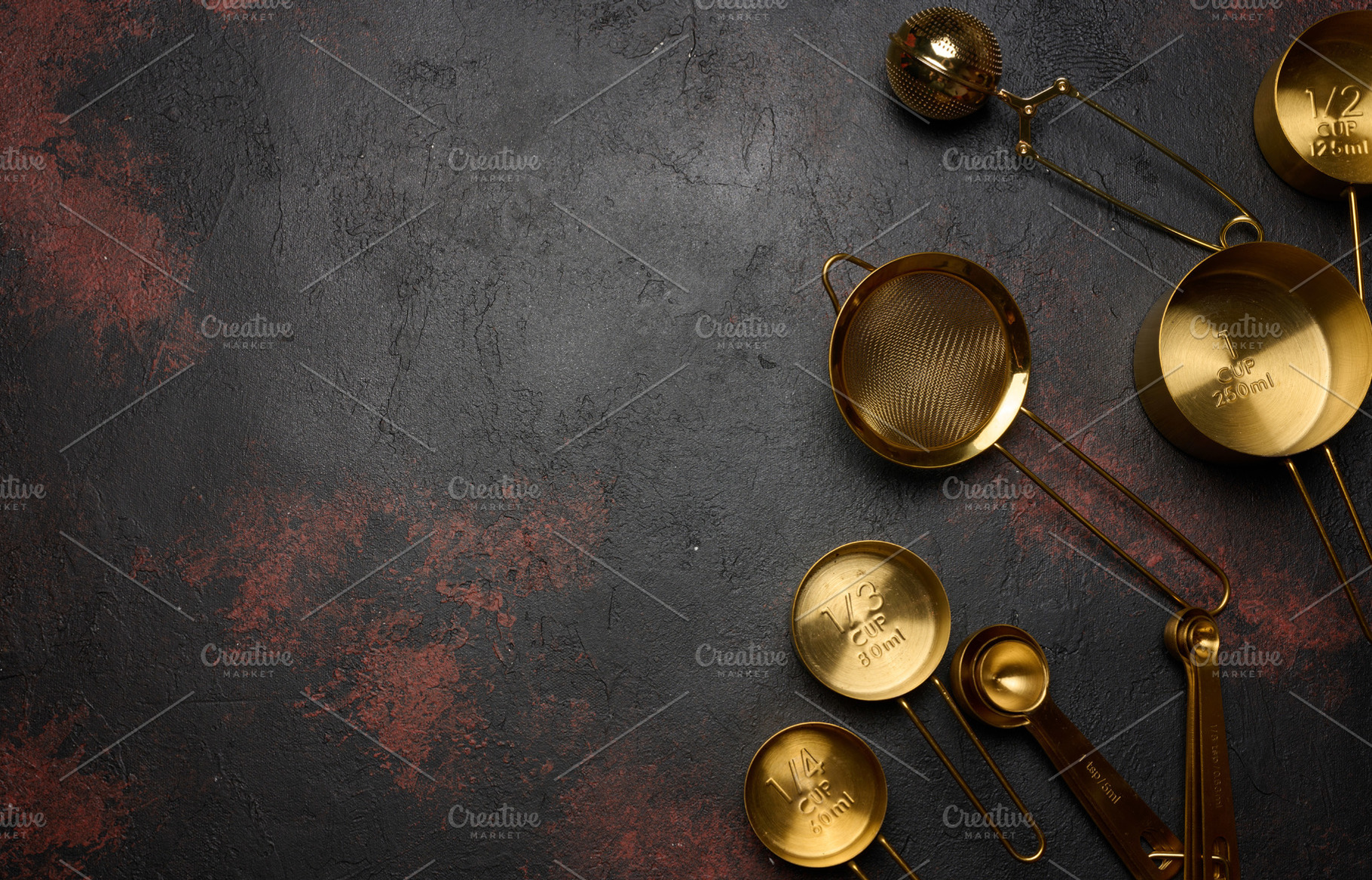 A gold-colored kitchen utensil set includes measuring cups of va, a Food & Drink Photo by ndanko
