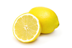 Two lemons isolated, a Photo by saiko3p