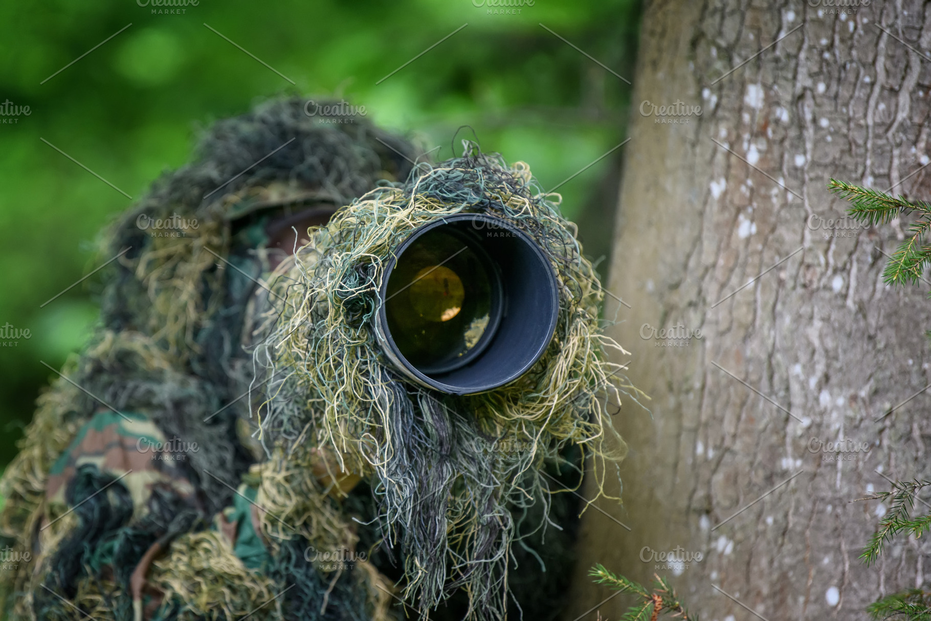 Wildlife photographer in the summer ghillie camouflage suit, a Person Photo by Byrdyak