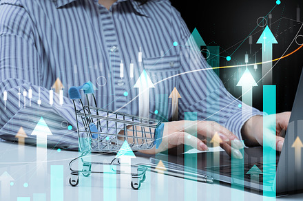 Woman sits at a laptop in front of a holographic chart with grow, a Business Photo by ndanko
