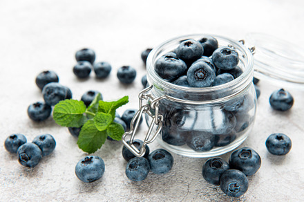 Blueberries on concrete background, a Food & Drink Photo by Olena Rudo
