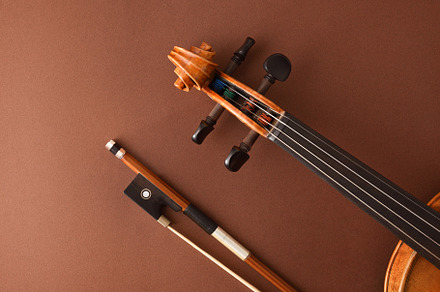 Peg box and fingerboard of violin and bow on brown, an Arts & Entertainment Photo by Davizro's Market