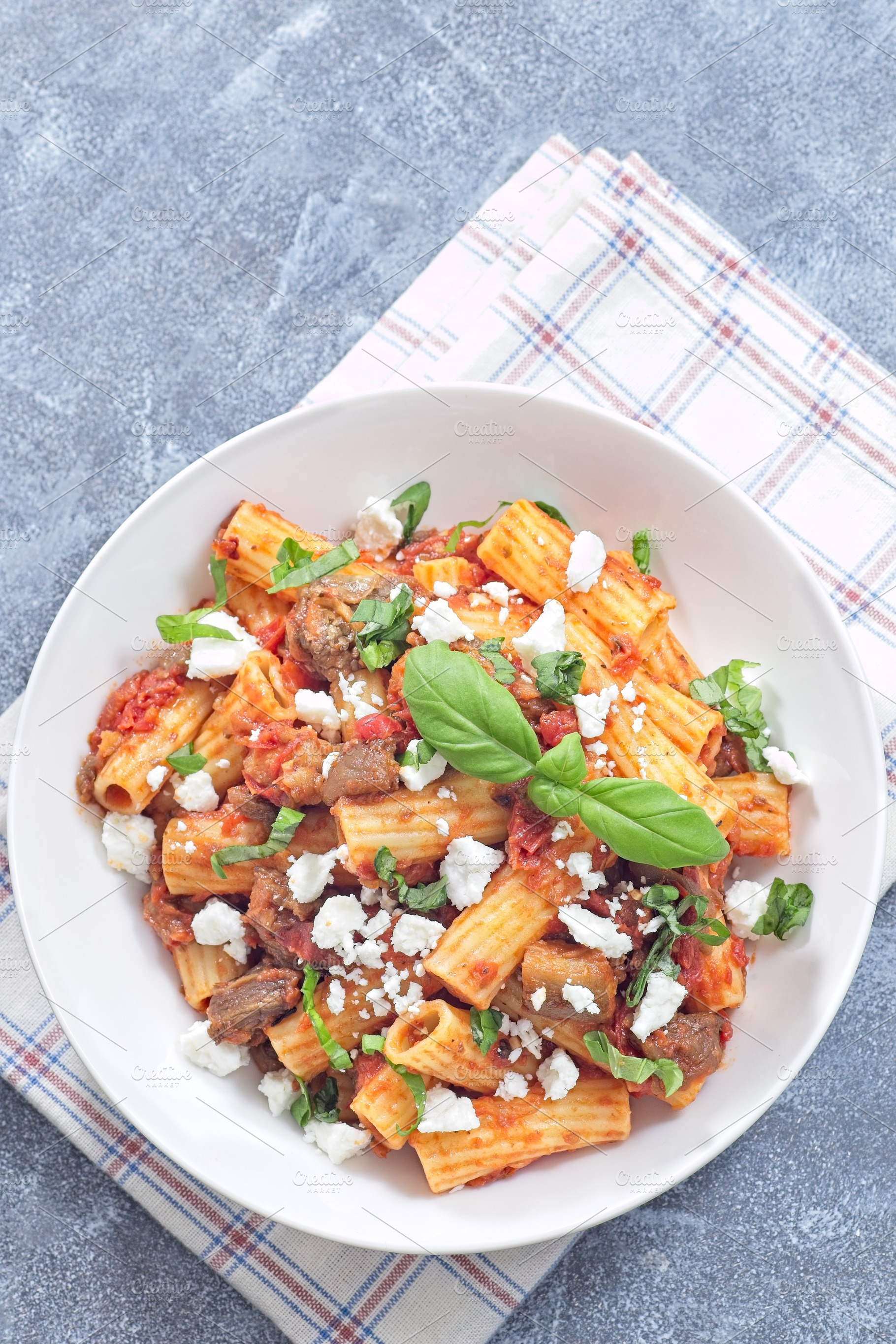 Rigatoni alla Norma pasta with eggplant, tomato, basil, ricotta salata, vertica, a Food & Drink Photo by iuliia_n