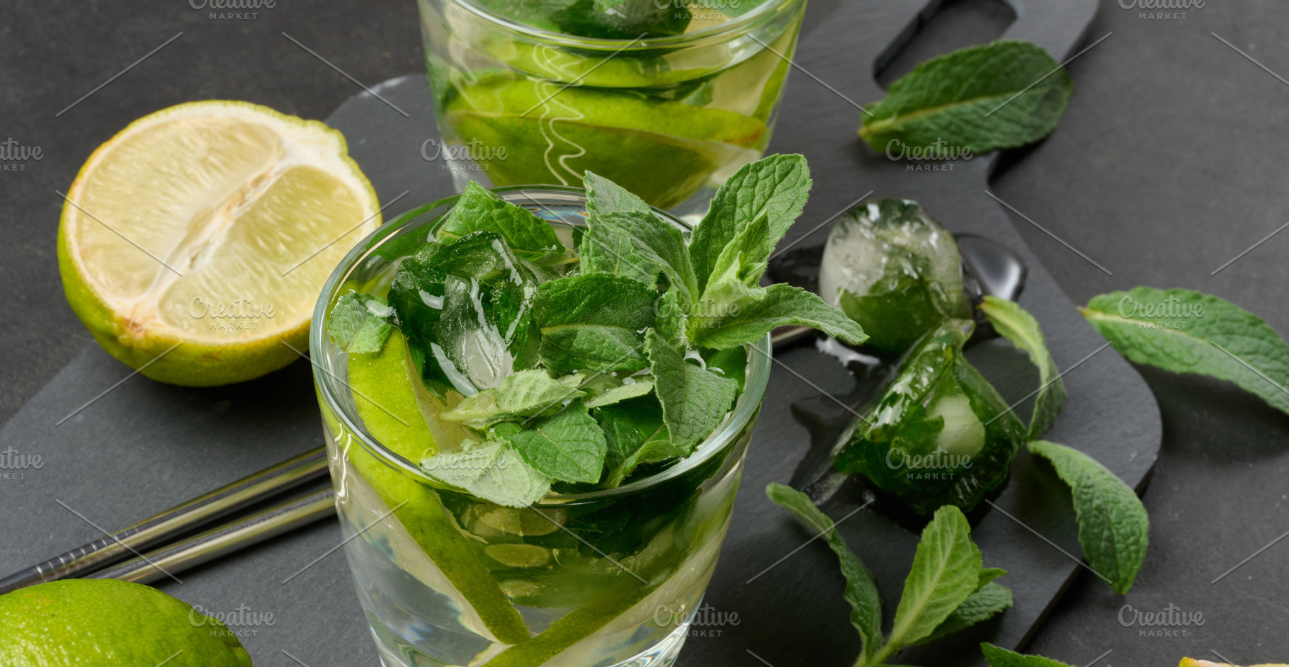 Refreshing mojito cocktail with lime, mint, strawberry, and ice, a Food & Drink Photo by ndanko