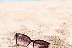 Abandoned sunglasses on the beach, a Beauty & Fashion Photo by BOOCYS
