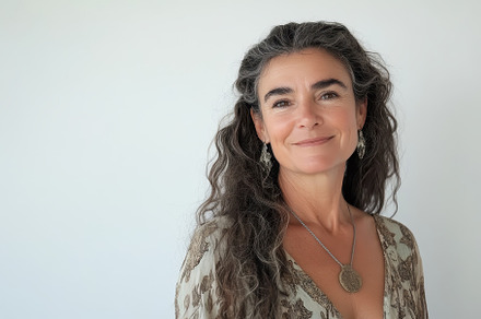 Mature woman smiling warmly while lo, a Photo by Iftikhar Alam