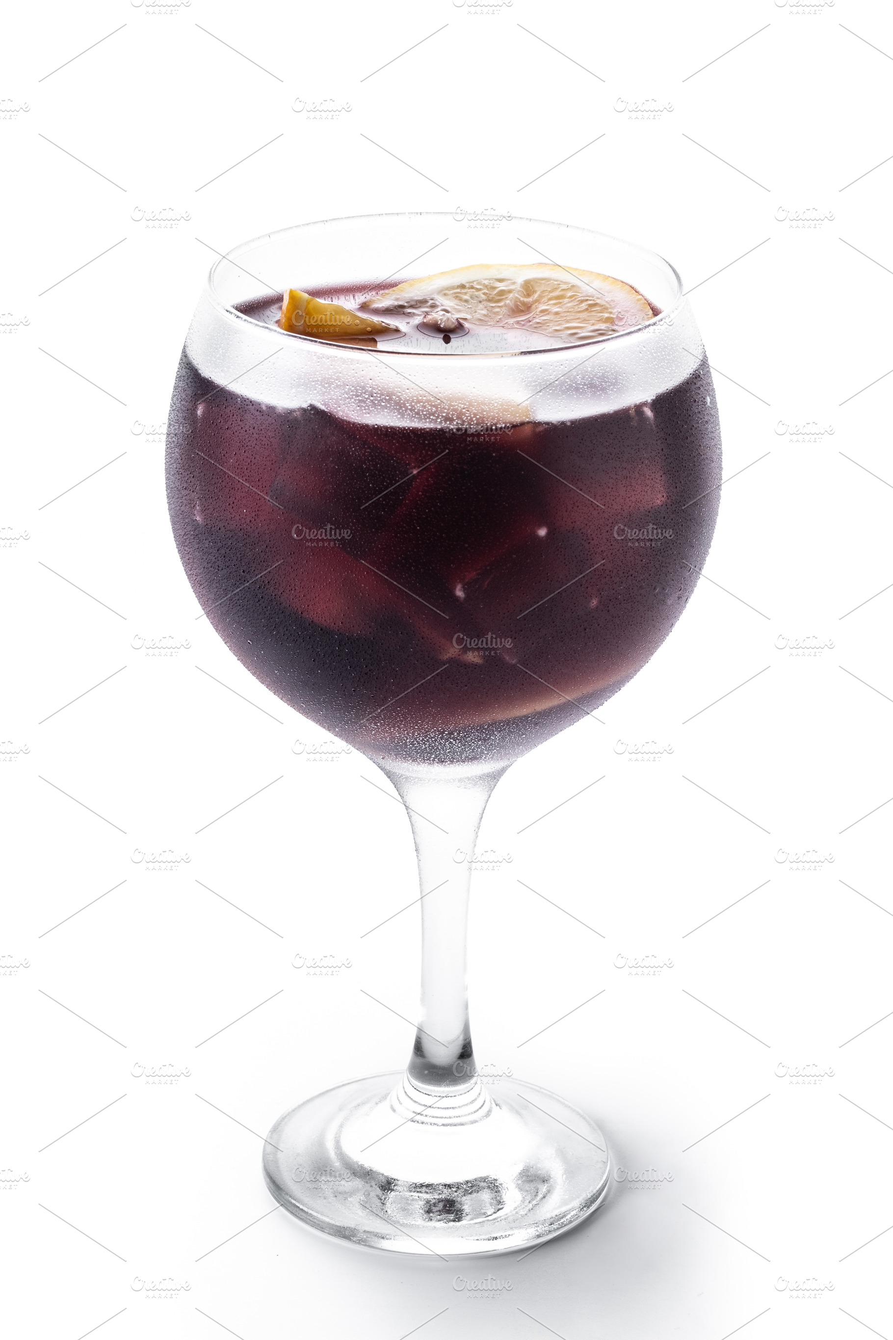 Refreshing Summer Citrus Fruit Sangria in crystal glass isolated on white backg, a Food & Drink Photo by etorres69